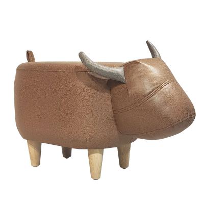 人氣牛凳子創(chuàng)意坐墩腳踏兒童坐凳可愛卡通家用頭層牛皮動物換鞋凳